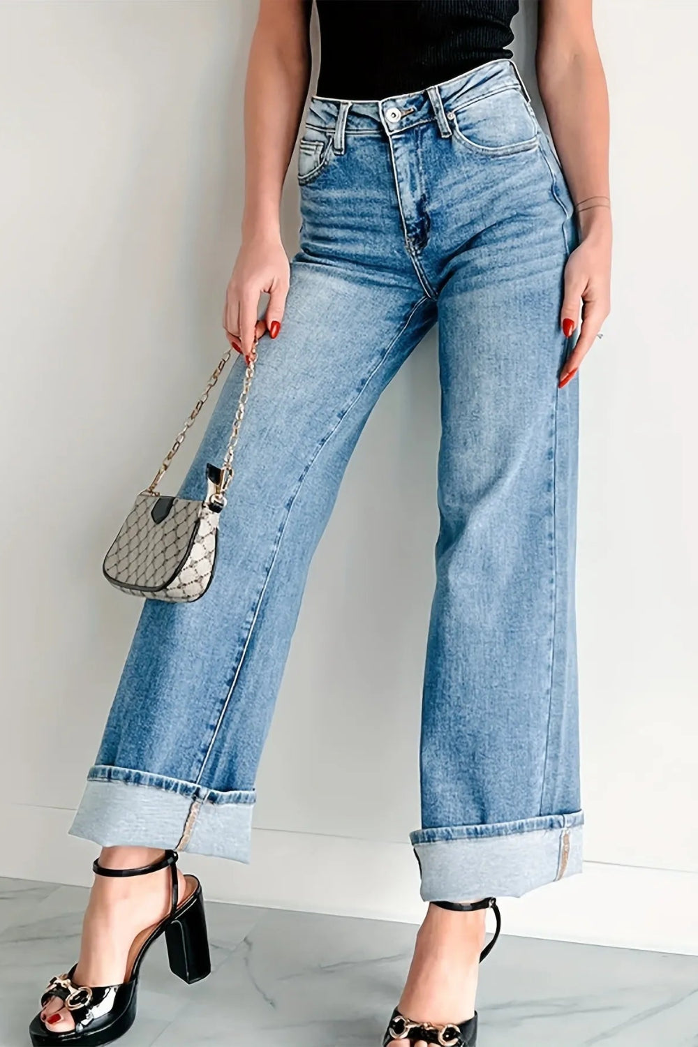 Jeans, high-waist, light wash, wide leg, pocketed, belt loops, button/zipper closure, relaxed fit, slightly stretchy, front view