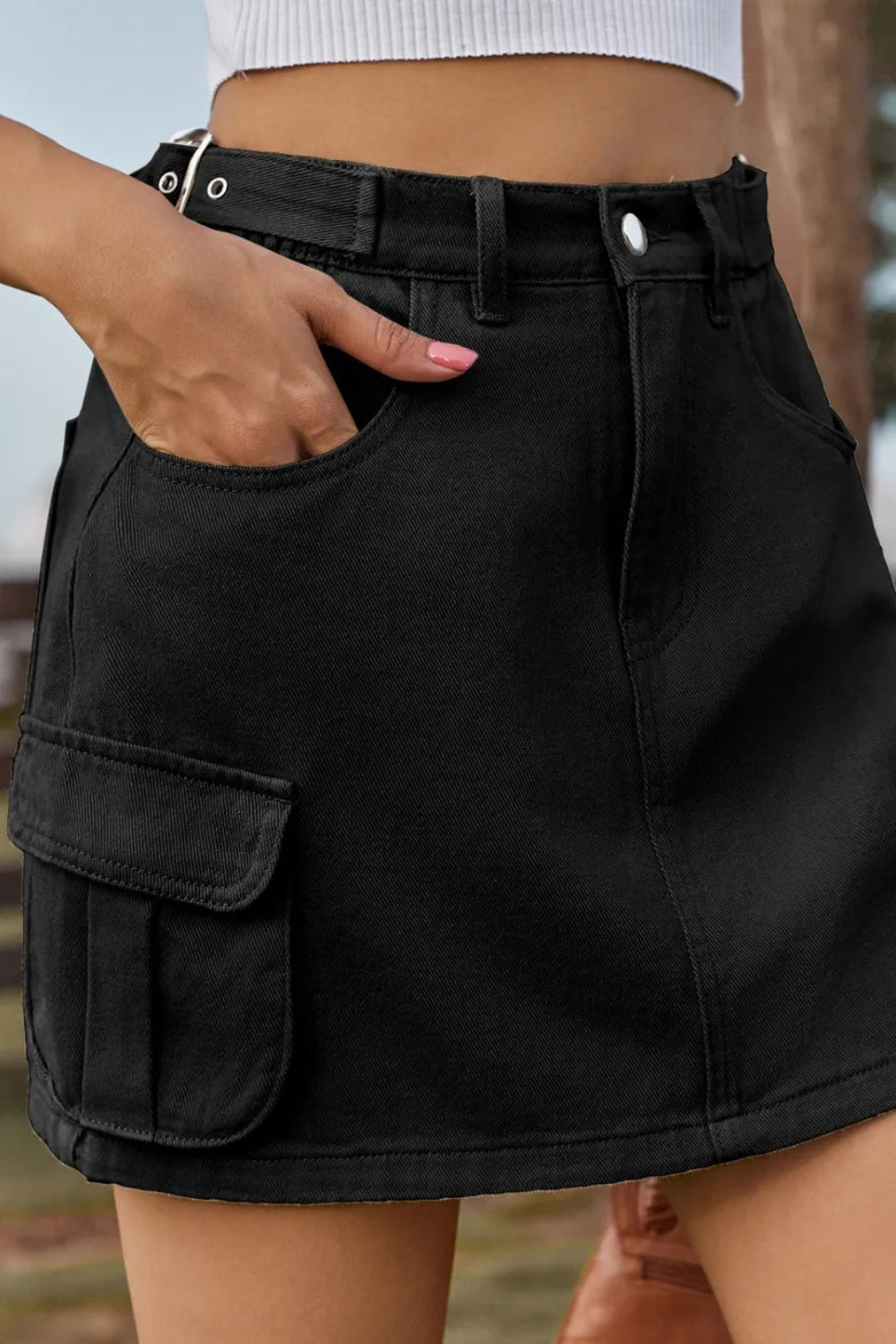 Adjustable Waist Denim Mini Skirt with cargo & patch pockets, elastic waist, and classic button-zip closure for a perfect, comfy, on-trend fit front view