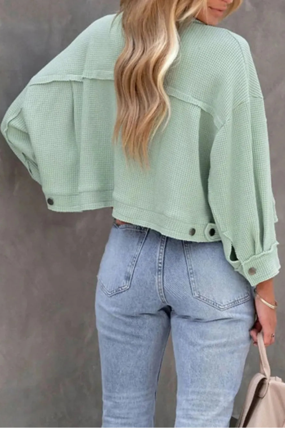 Jacket, collared, oversized, distressed, pleated, drop shoulder, buttoned, pocketed, long sleeve, waffle-knit, exposed seam, sits at the waist, pleated, adjustable straps, some stretch back view