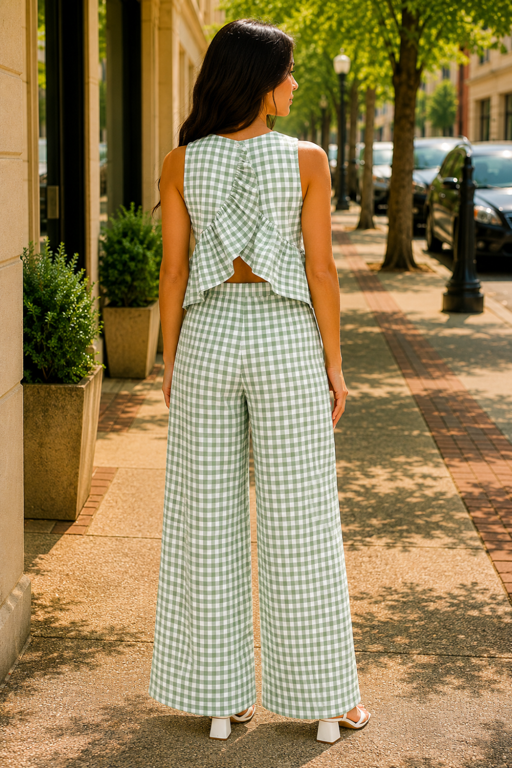 * Two-piece set
* Round neck
* Sleeveless
* Buttoned back closure
* Elastic waist
* Wide leg
* Ruffled
* No stretch