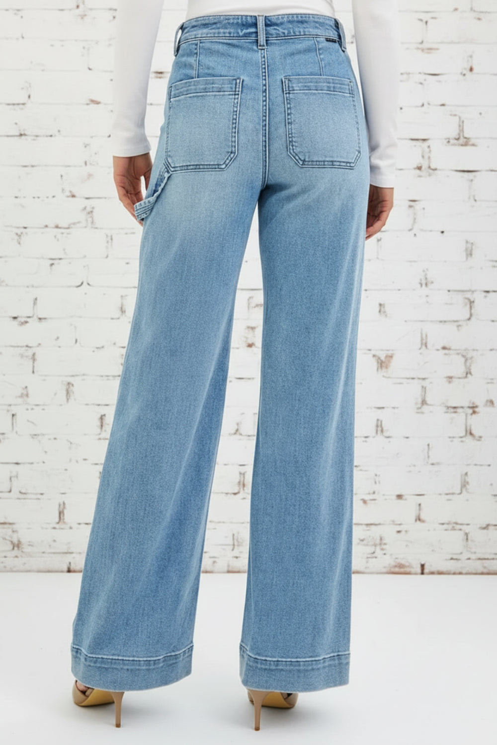 Risen Jeans, full-size, high-rise, straight let, light wash, front patch pockets, back pockets, long hem, button/zipper closure, belt loops, hammer loops on side, slightly stretchy, back view