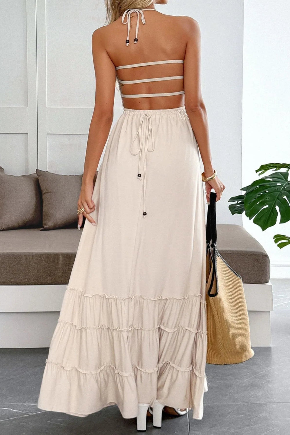 Maxi dress, halter tied, sleeveless, smocked, tiered, ruffled, frilled, backless, unlined, slightly stretchy, back view