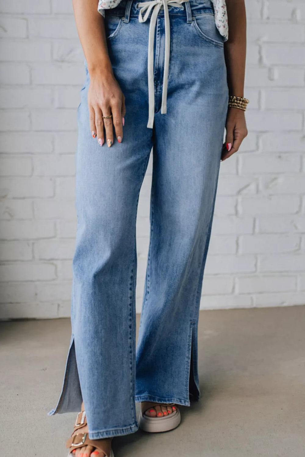 Jeans, slide slit, loose fit, wide leg, vintage wash, drawstring, button/zipper closure, pocketed, belt loops, some stretch, front view
