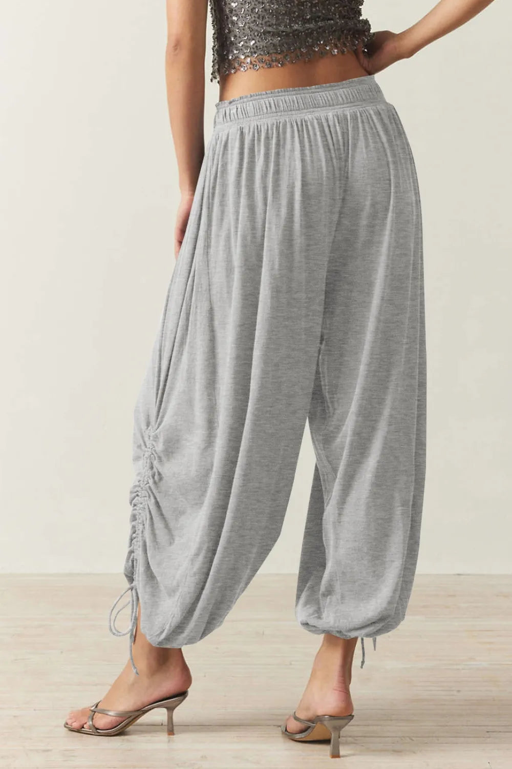Pants, opaque, ruched, drawstring, elastic waist, opaque, pleated, adjustable hem ties, no stretch, back view

