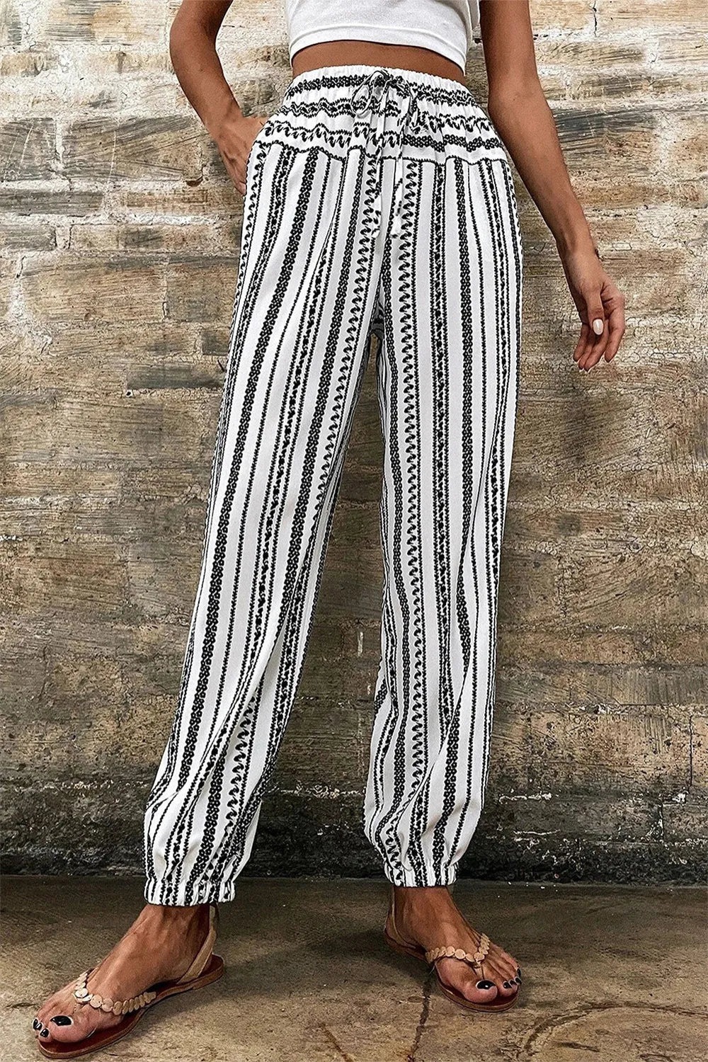 Joggers, high elastic drawstring waist, pocketed, elastic hem, opaque, geometric stripes, no elasticity front view