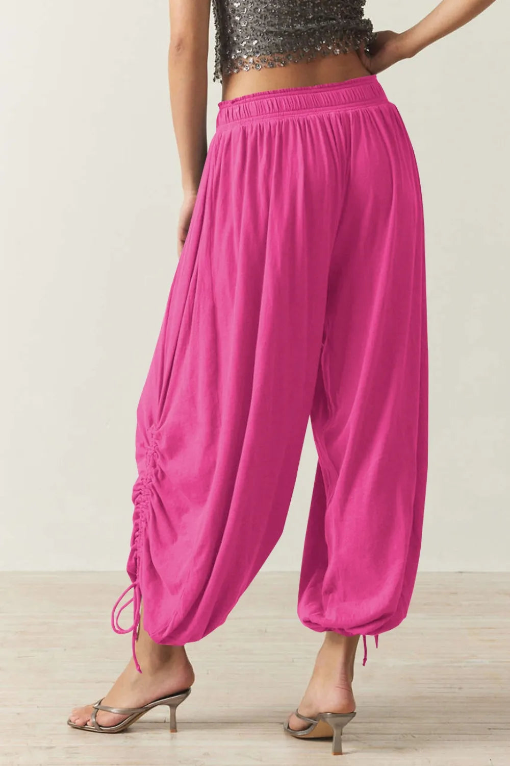 Pants, opaque, ruched, drawstring, elastic waist, opaque, pleated, adjustable hem ties, no stretch, back view
