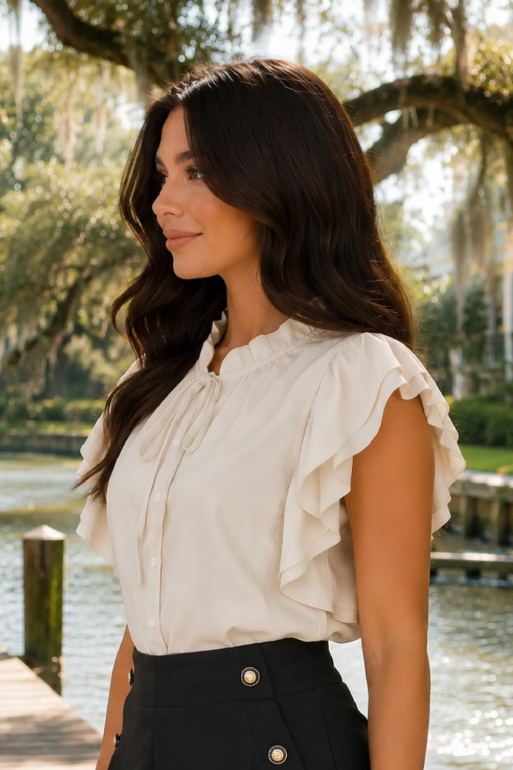 * Ruffle neck
* Ruffle sleeve
* Buttoned
* Tied
* Medium length
* Cream color
* Round hem
* No stretch
