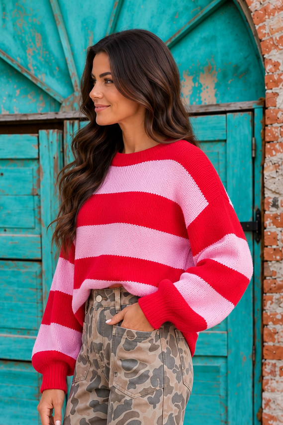 Cherry Crush Sweater in red and pink horizontal stripes, side view showing oversized fit, crew neckline and balloon sleeves.
