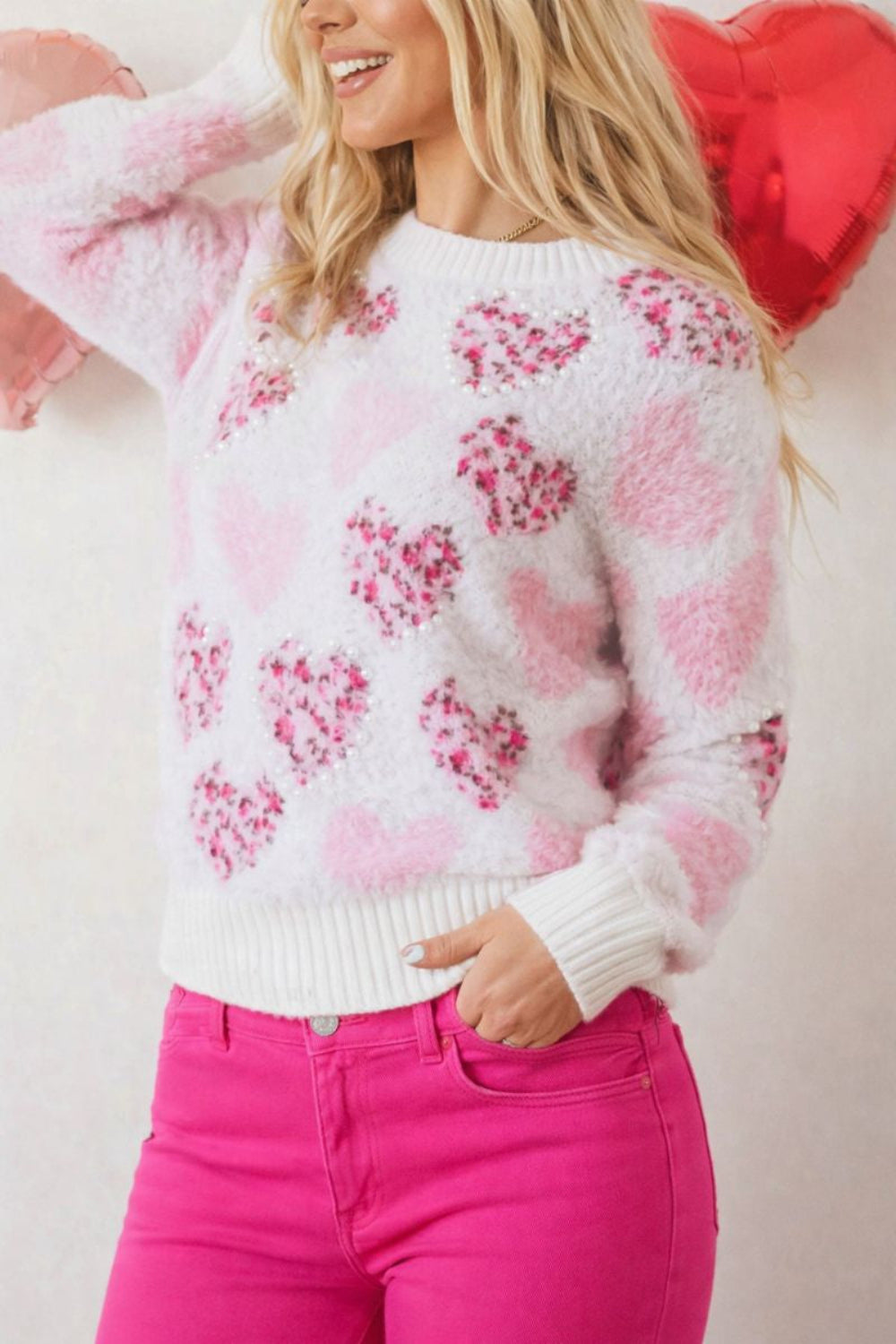 sweater, pullover, round neck, drop shoulder, ribbed neck, cuffs and hem, long sleeve, fuzzy texture, hearts with leopard print adorned with pearl trim, slightly stretchy, front view