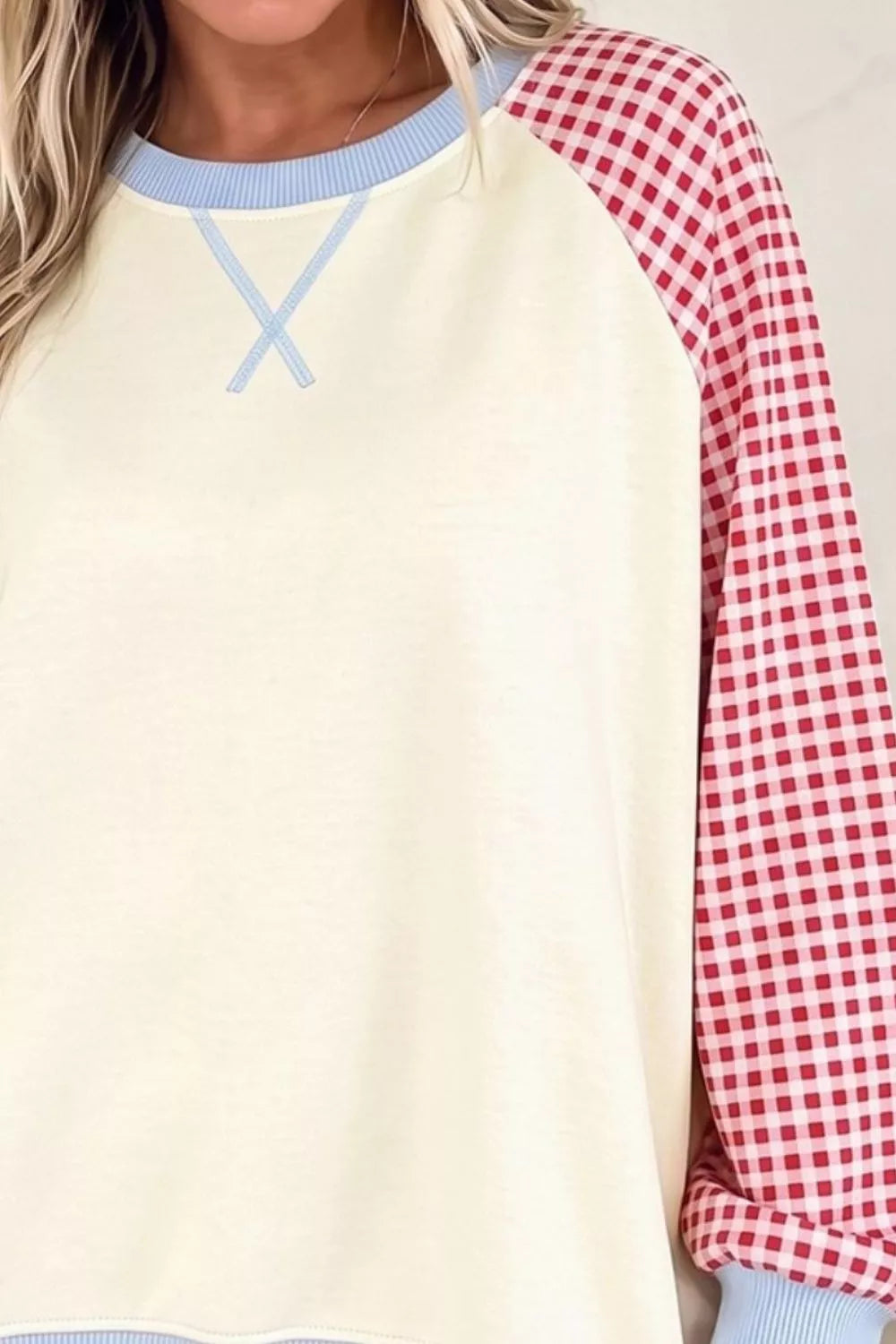 Day Dreaming Sweatshirt in cream with red gingham raglan sleeves and light blue ribbed trim, shown close-up.