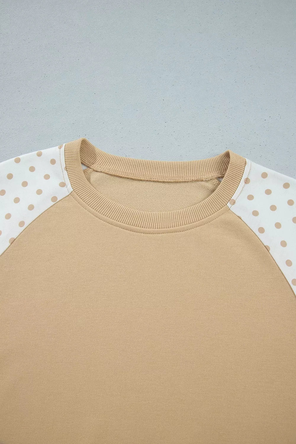 * Two-piece pant set
* Polka dot patchwork
* Round neck
* Long sleeve
* Drop shoulder
* Ribbed
* Oversized top
* Sits at waist
* High-waist
* Elastic waist
* Drawstring
* Pocketed
* Wide leg
* Slightly stretchy