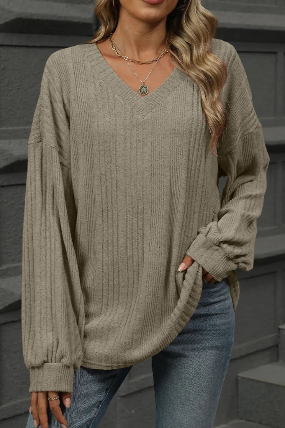 Top, v-neck, long sleeve, bishop sleeve, drop shoulder, ribbed, opaque, oversized, slightly stretchy, front view close up
