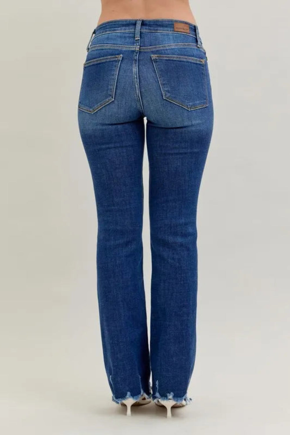 Judy Blue Jeans, full-size, mid-rise, vintage dark wash, 5-pocket design, relaxed fit, button-zip closure, distressed hem, subtle whiskering, bootcut, slightly stretchy, back view