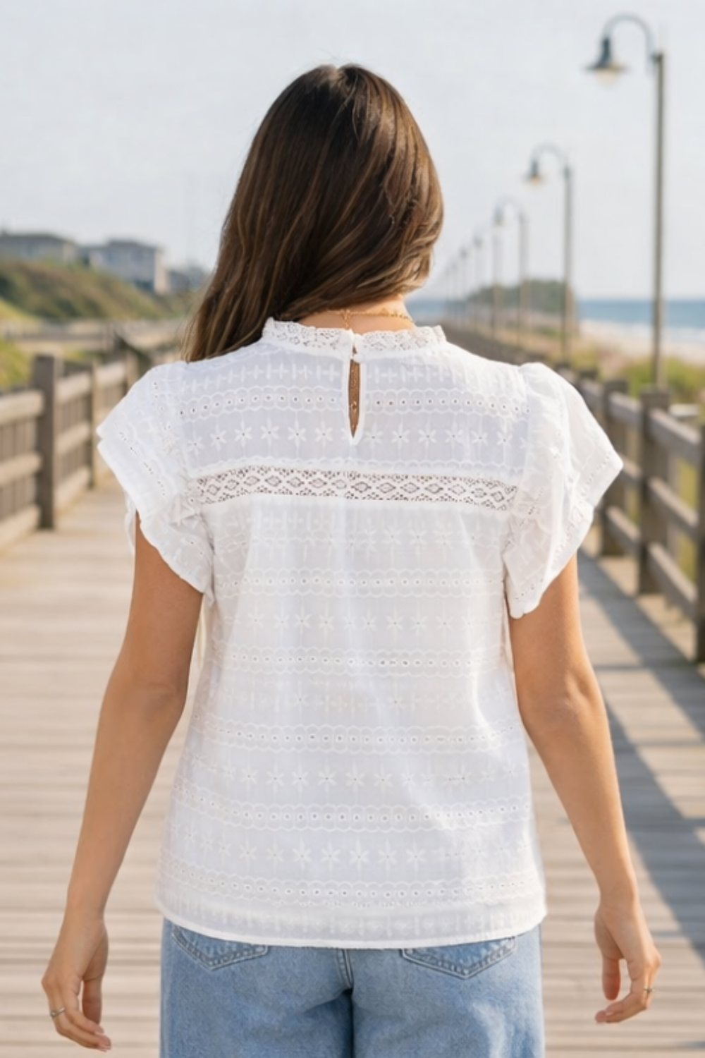 * Round neck
* Flutter sleeve
* Keyhole closure
* Eyelet
* Lace
* Opaque
* Some stretch