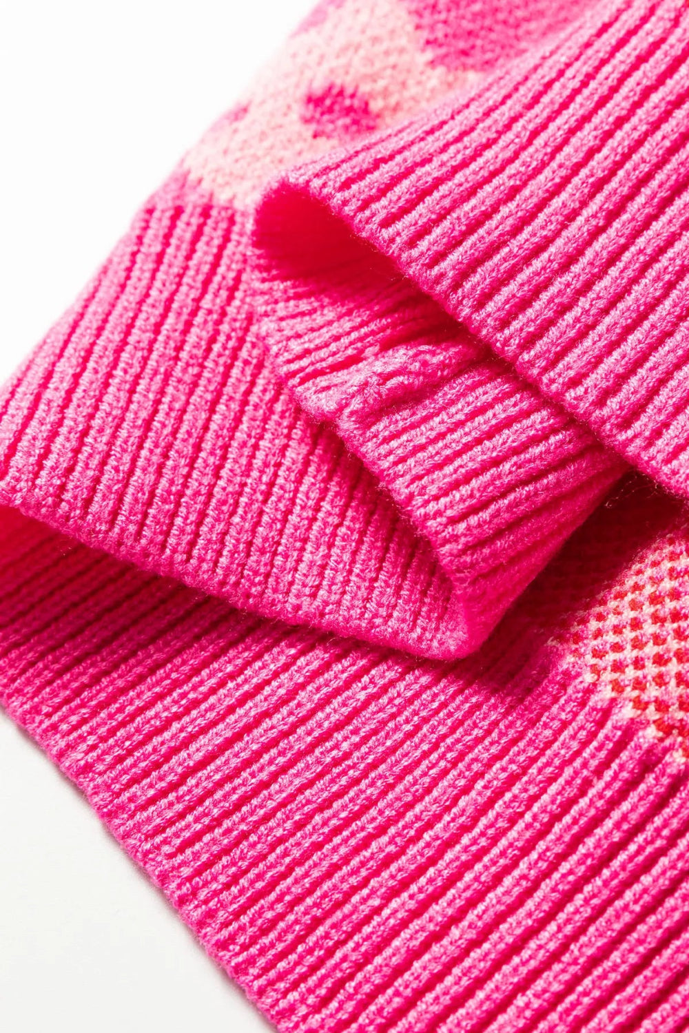 sweater, pullover, long sleeve, drop shoulder, round neck, flower print, ribbed trim, medium length, slightly stretchy, close up view