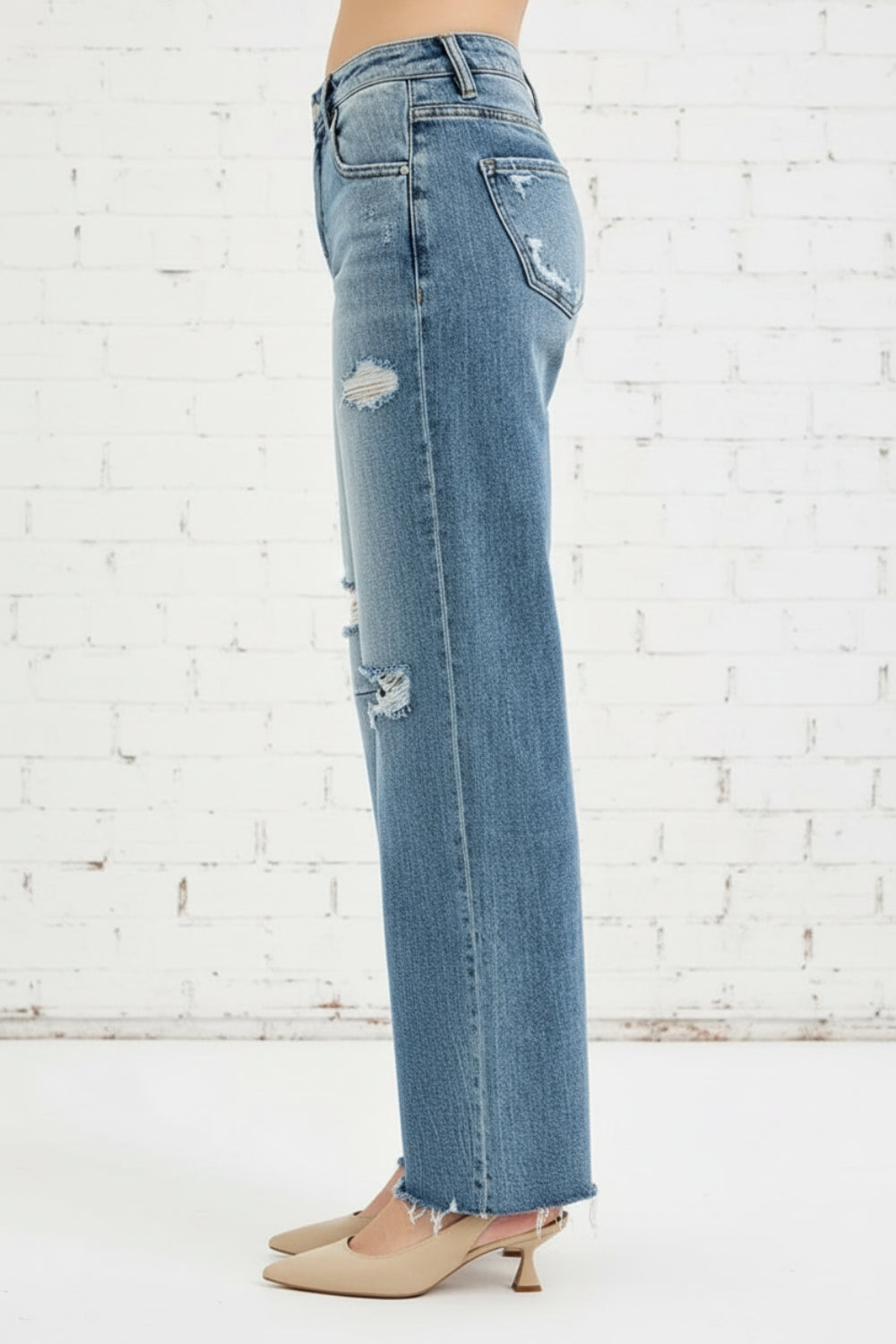 Risen Jeans, full-size, mid-rise, wide, baggy leg, distressed, darted, raw hem, belt loops, button/zipper closure, pocketed, slightly stretchy, side view
