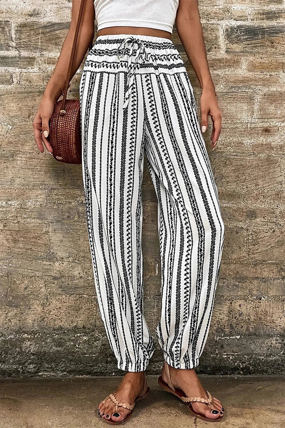 Joggers, high elastic drawstring waist, pocketed, elastic hem, opaque, geometric stripes, no elasticity front view