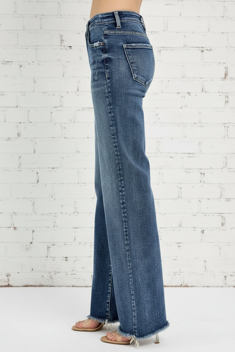 Risen Jeans, full-size, high-rise, distressed, raw hem, long, straight leg, dark wash, button/zipper closure, belt loops, pocketed, slightly stretchy, side view