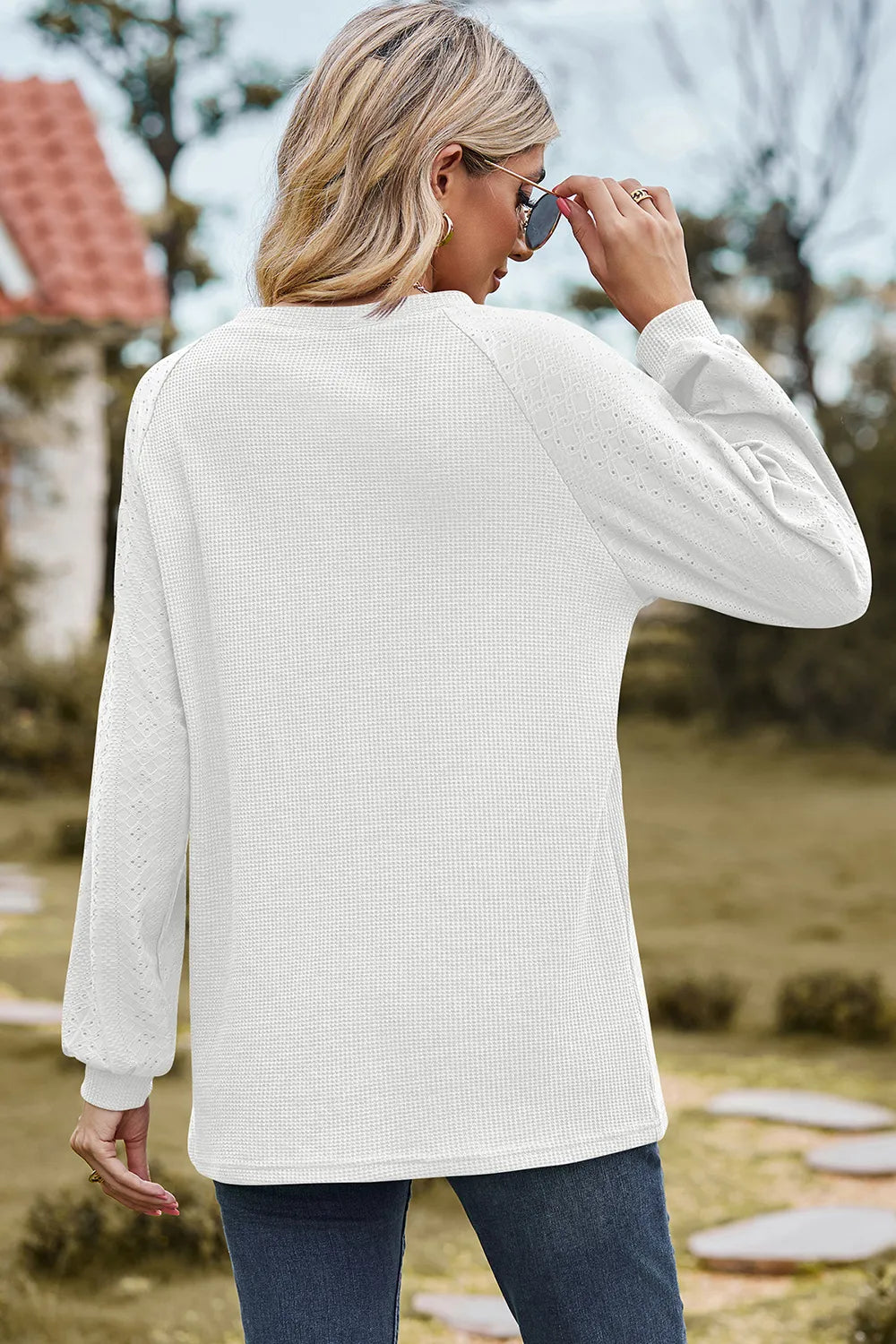 Top, raglan style, round neck, long sleeve, eyelet sleeves, ribbed, opaque, slightly stretchy, back view