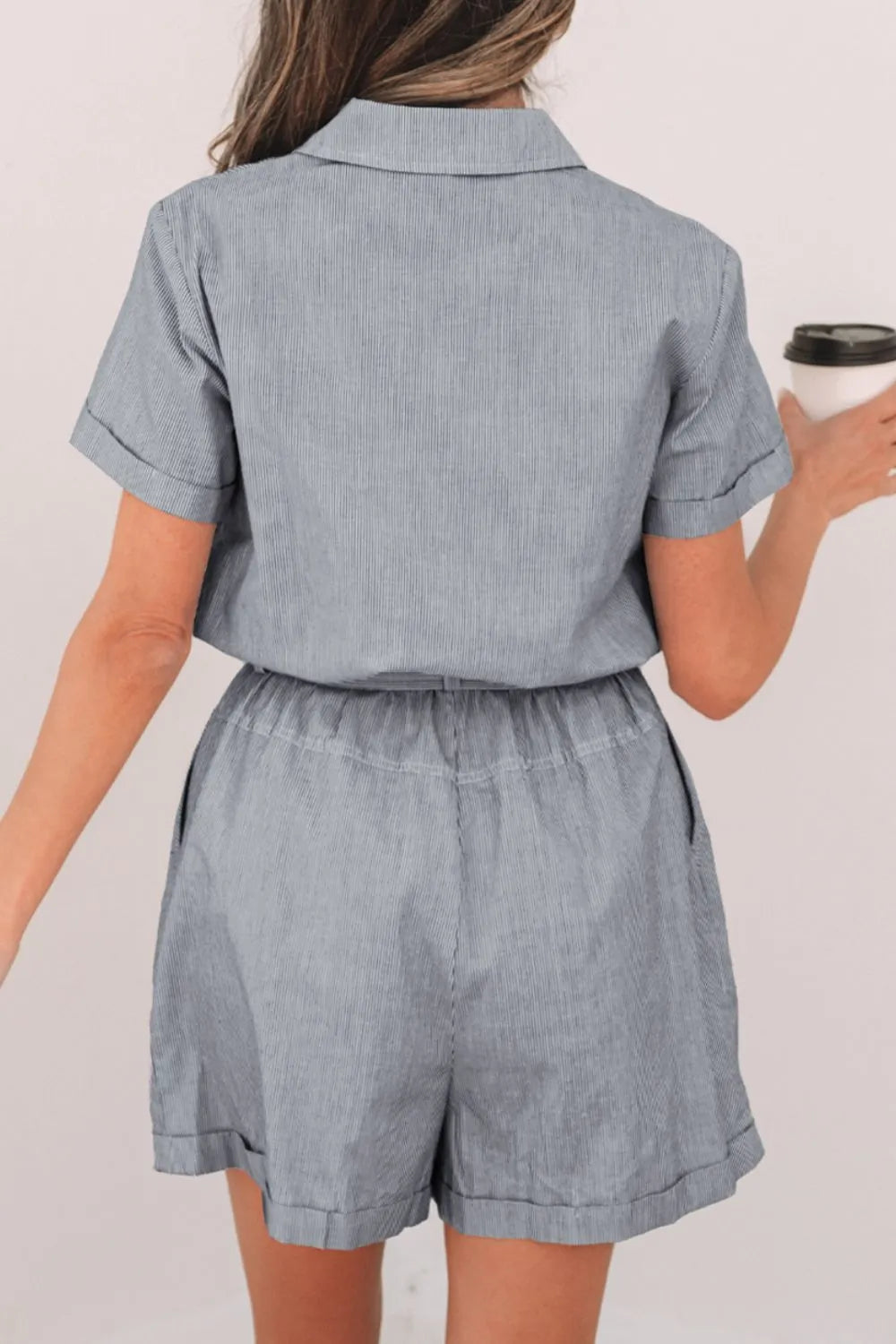 Romper, collared, short sleeve, cuff sleeve, buttoned, belted, opaque, pleated, elastic waist, no stretch back view