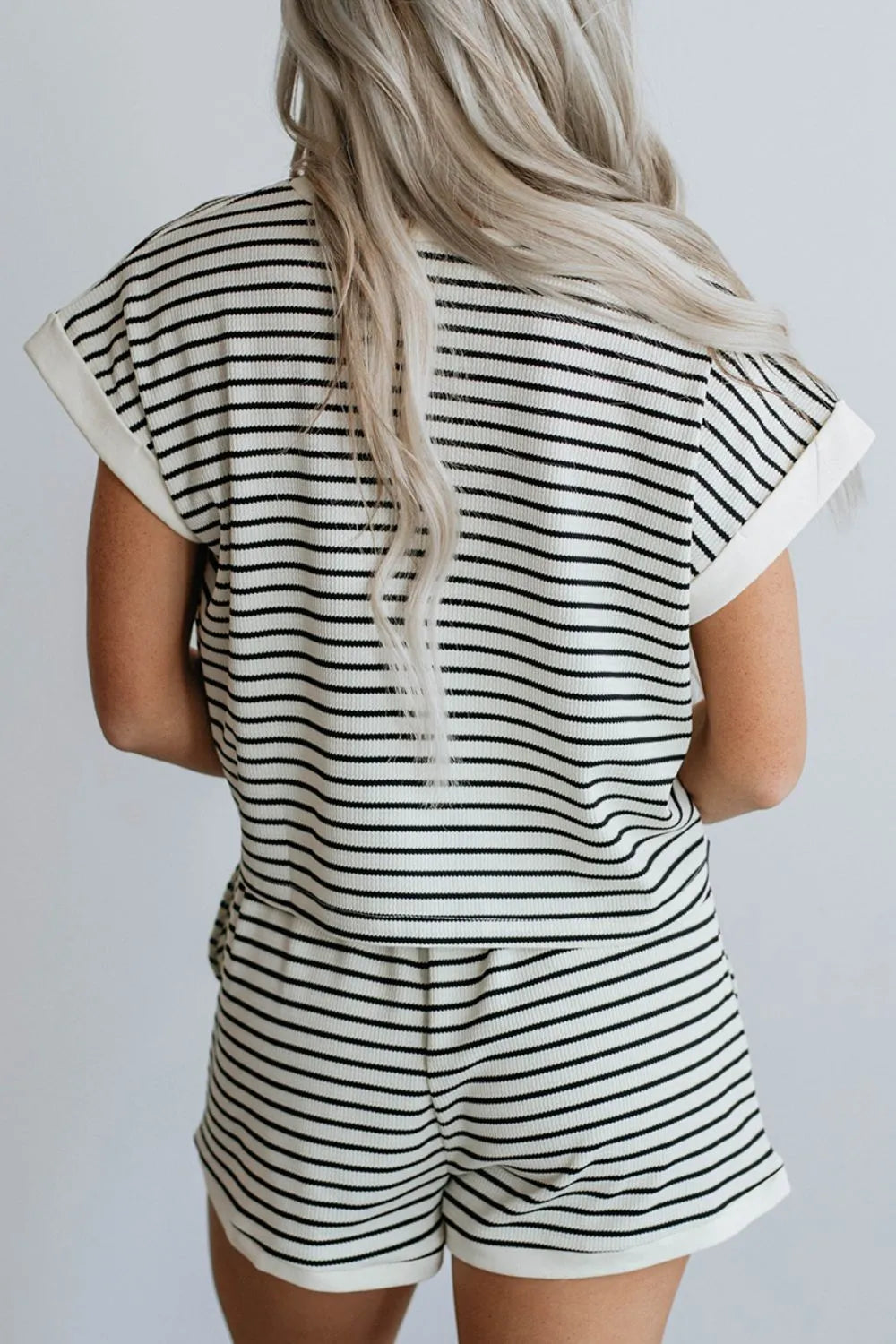 Two-piece short set, short sleeve, cuffed sleeve, cropped, striped pattern, contrast trim, elastic waist, pocketed, no drawstring, slightly stretchy back view