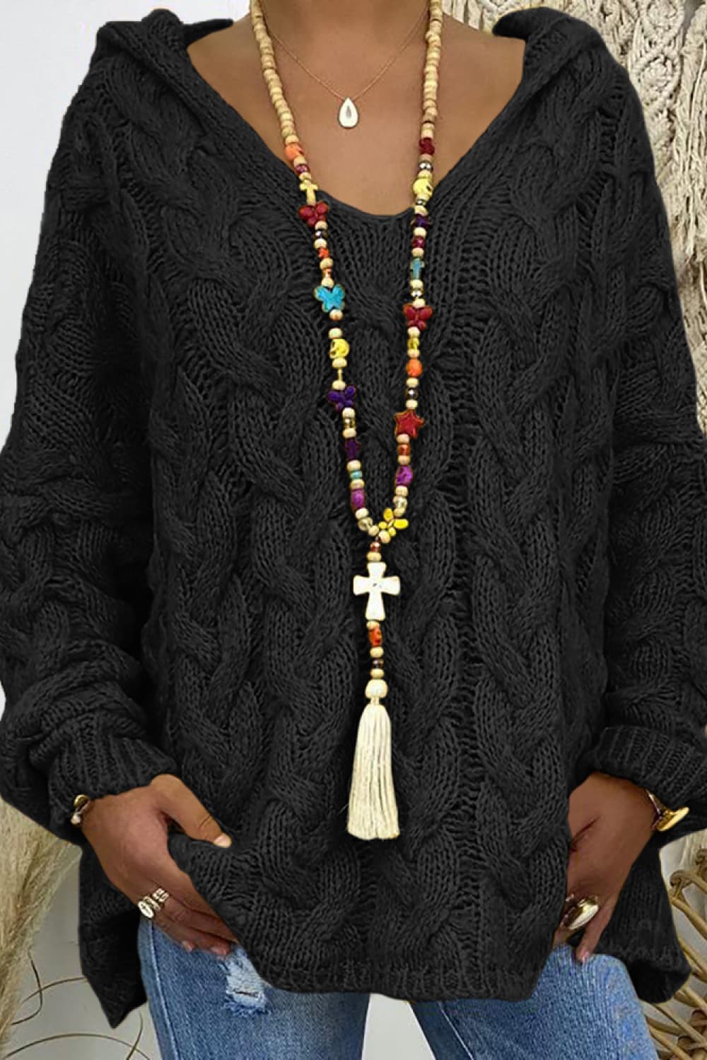 * Sweater
* Hooded
* Long sleeve
* Cable-knit
* Oversized
* Slightly stretchy