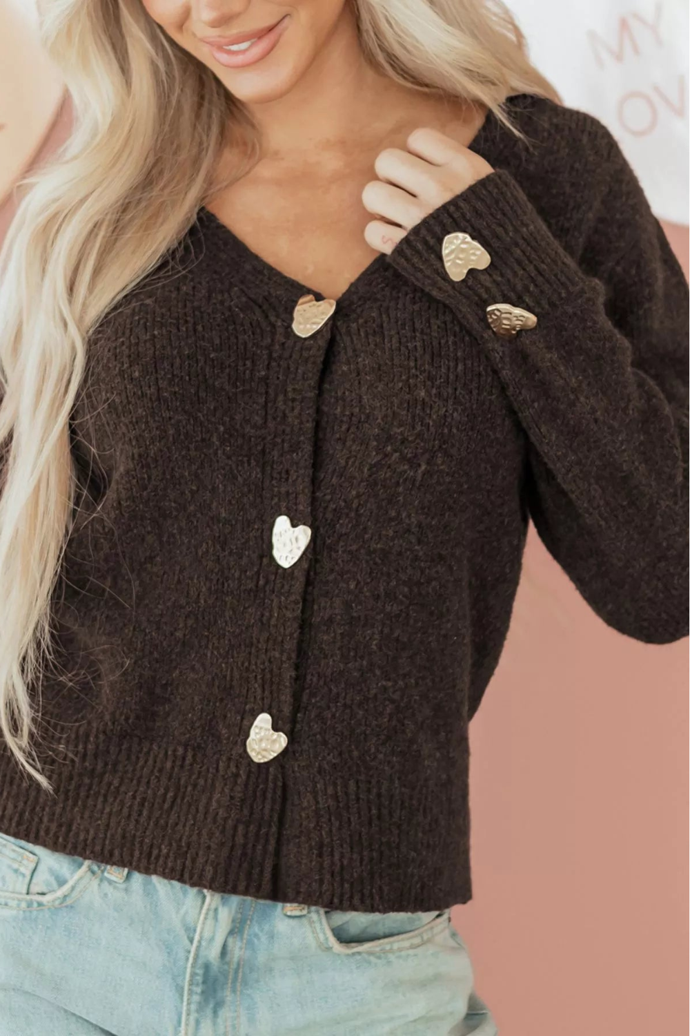 cardigan, chocolate color, long sleeve, v-neck, metal heart shaped button on front and cuffs, ribbed, medium length, slightly stretchy, front view
