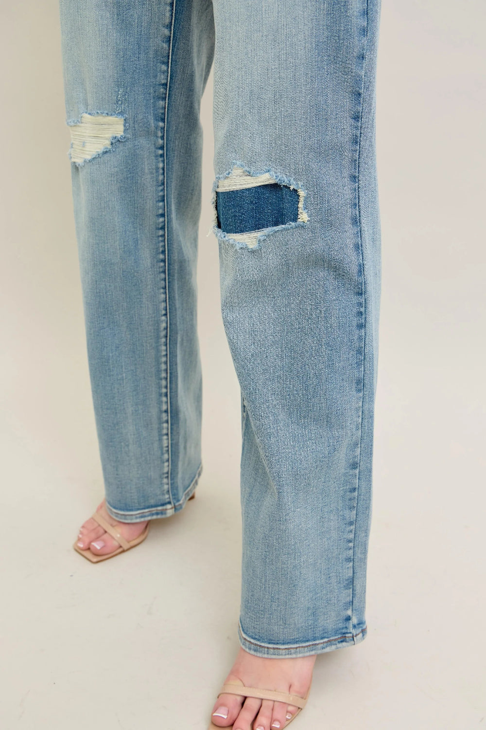 Judy Blue Jeans, full-size, high-rise, destroyed knee patch, distressed, pocketed, button and zipper closure, light wash, slightly stretchy, close up view