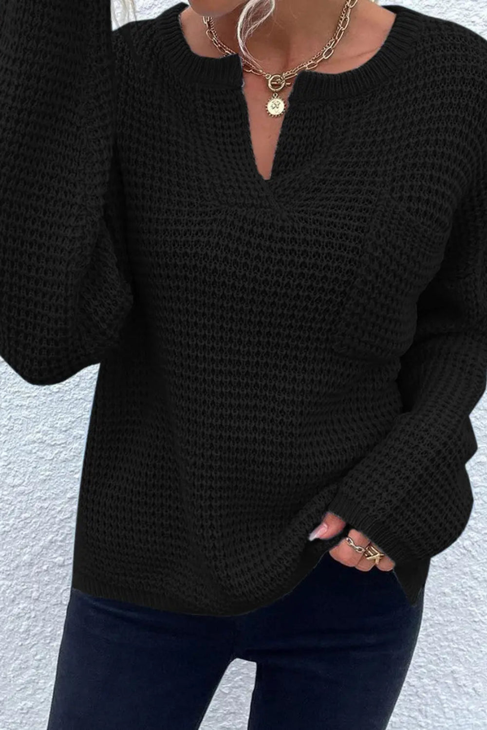 sweater, pullover, long sleeve, drop shoulder, front pocket, notched neck, ribbed, knit, slightly stretchy, front view close up