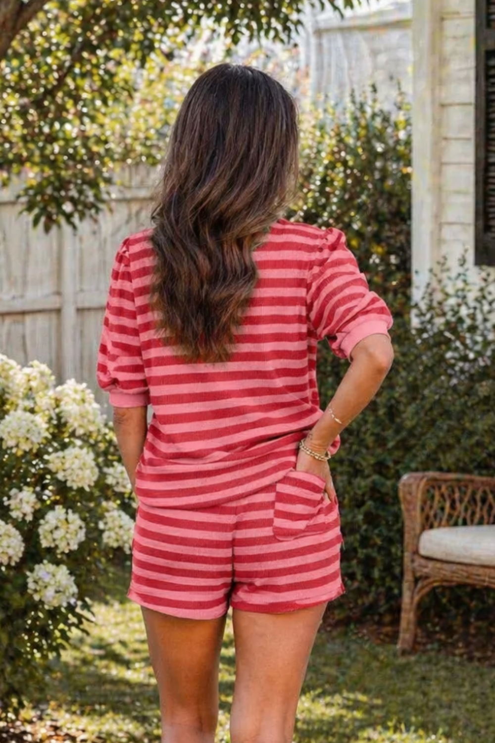 Two-piece set
* Pullover top
* Round neck 
* Short puff sleeves
* Striped
* Drawstring shorts
* Pocketed
* Back patch pocket
* Stretchy