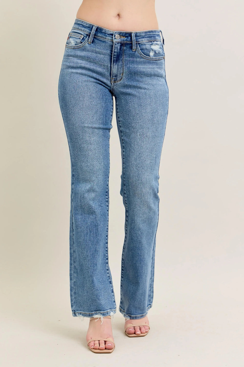 Judy Blue Jeans, mid-rise, full-size, washed, pocketed, raw hem, bootcut, slightly stretchy front view 
