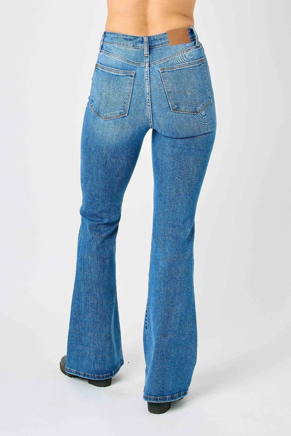 Judy Blue Jeans, full-size, high-rise, flared, pocketed, button and zipper closure, medium wash, slightly stretchy back view 