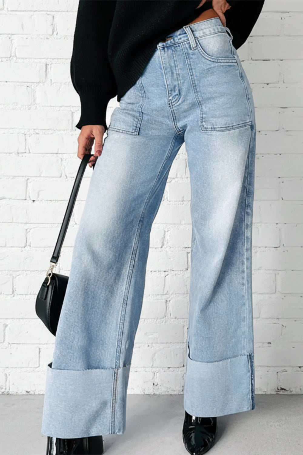 Jeans, high-waist, wide leg, high raw hem cuff, front patch pockets, light vintage wash, back pockets, belt loops, button/zipper closure, relaxed fit, slightly stretchy, front view
