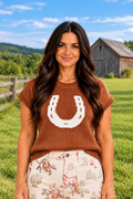 Front view of the Horseshoe Sweater in rust brown knit with a white horseshoe graphic, crew neckline, and ribbed cap sleeves.