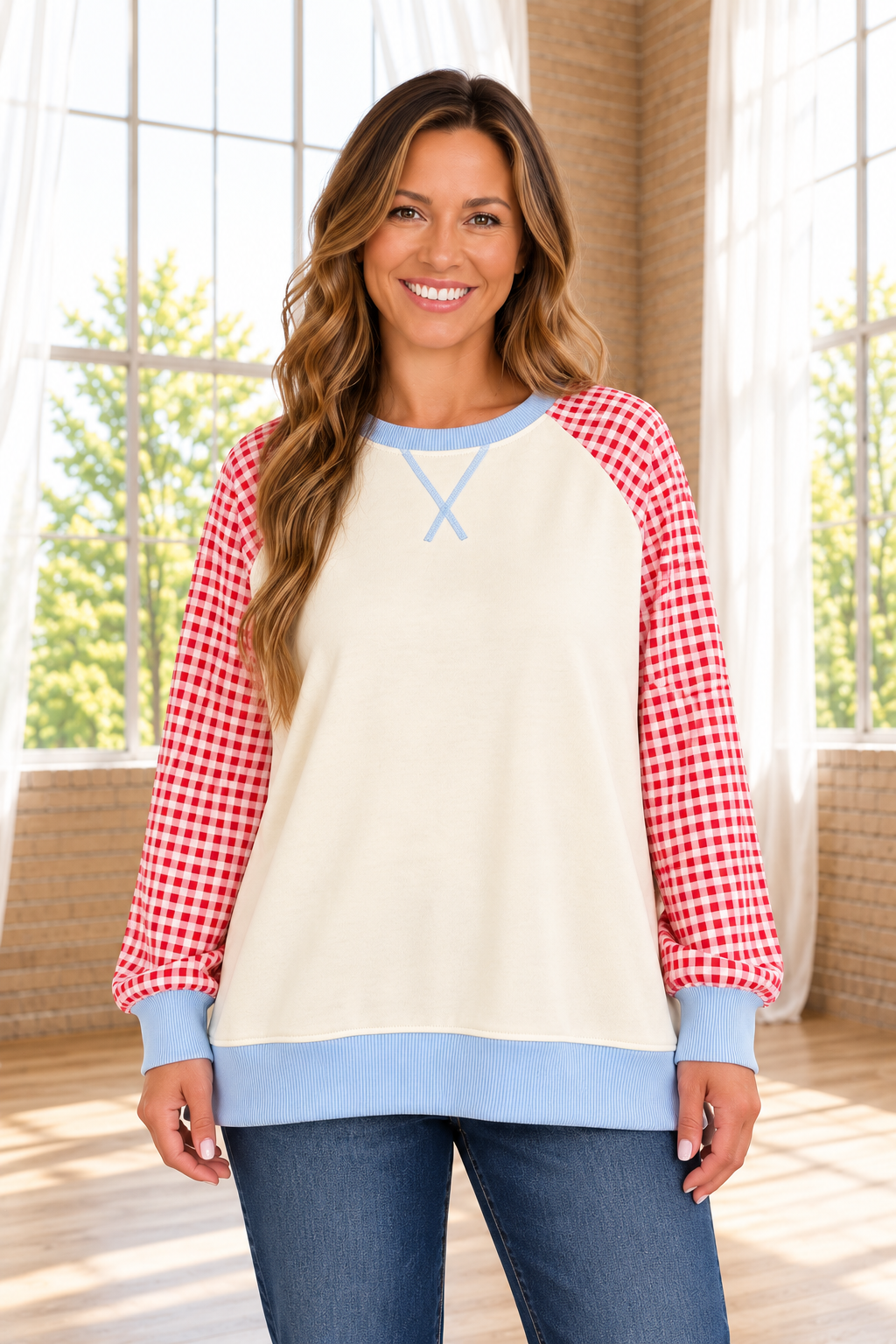 Day Dreaming Sweatshirt in cream with red gingham raglan sleeves and light blue ribbed trim, shown from the front.