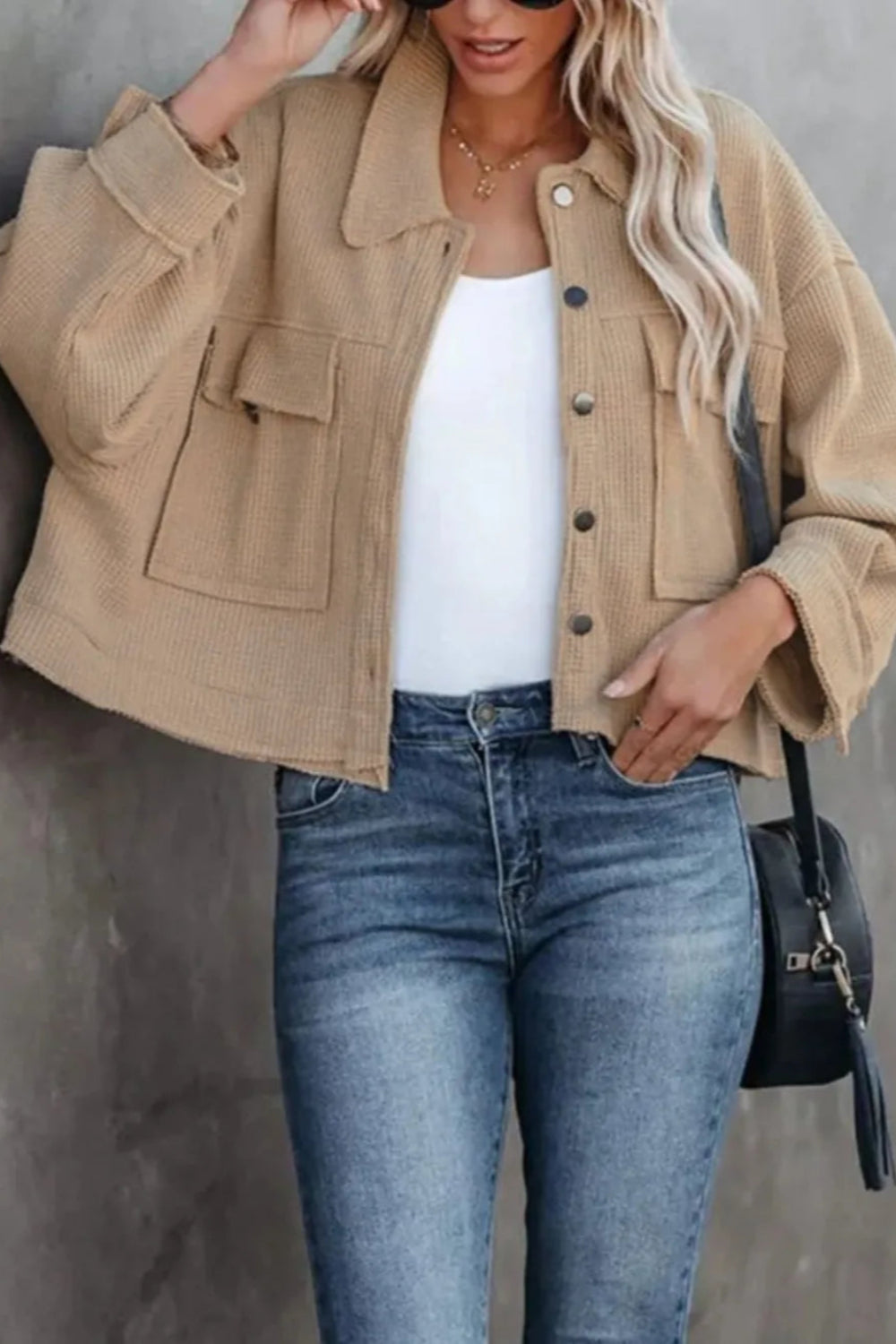 Jacket, collared, oversized, distressed, pleated, drop shoulder, buttoned, pocketed, long sleeve, waffle-knit, exposed seam, sits at the waist, pleated, adjustable straps, some stretch front view