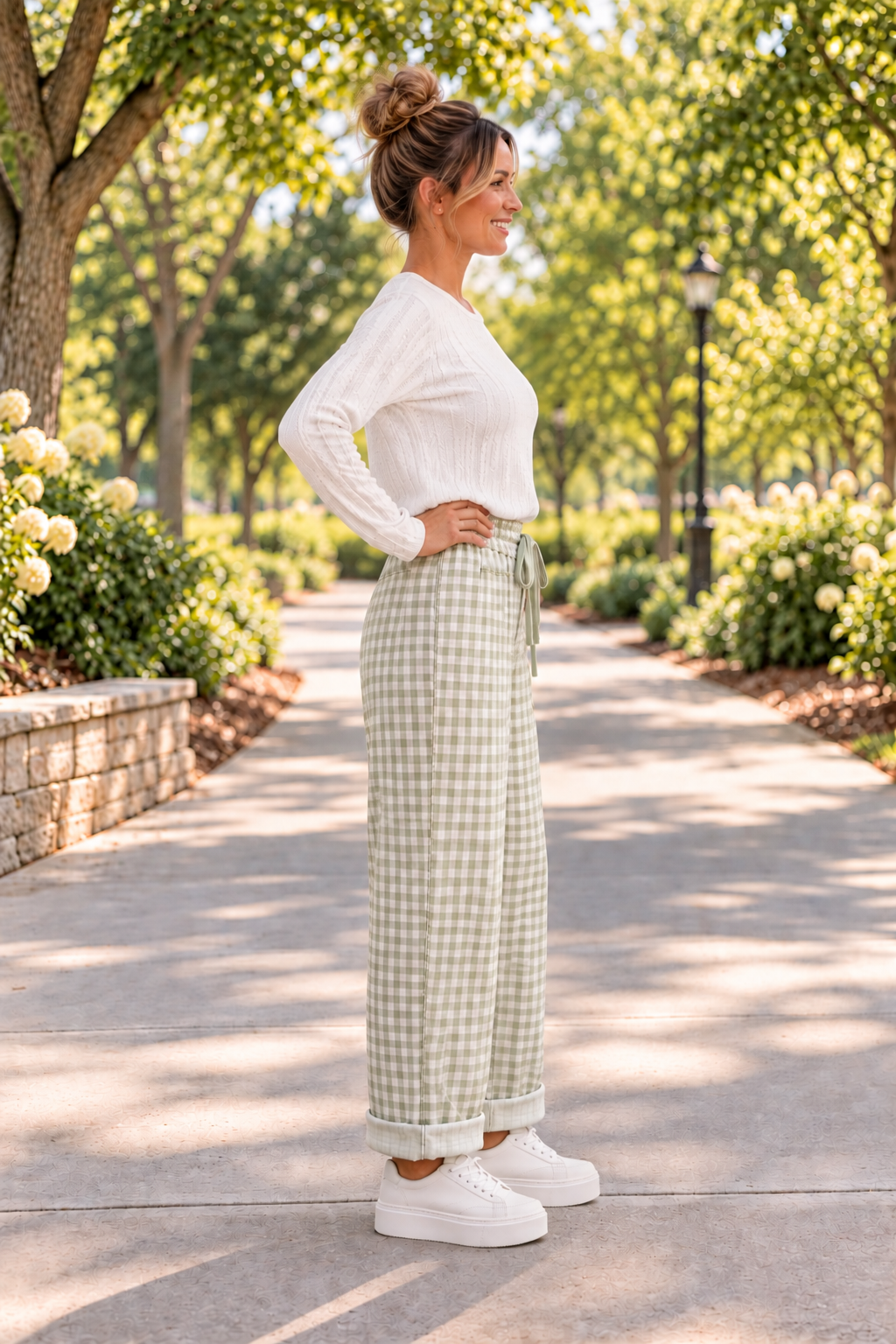 The Reece Pants in red and cream gingham with wide cuffed legs, a drawstring waist, front pockets, and vertical seams side view.