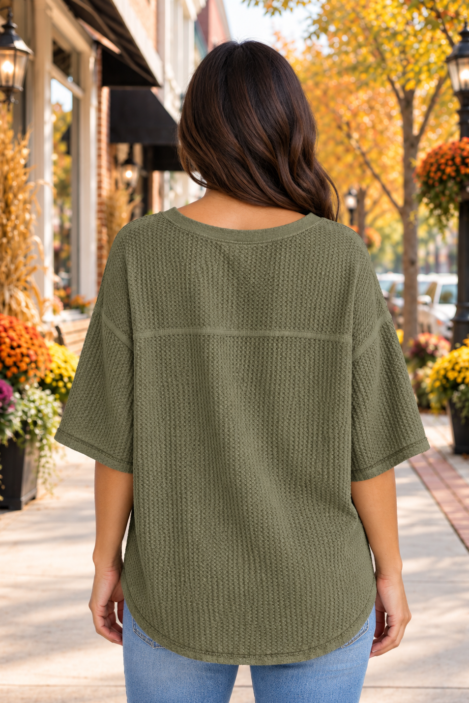 Back view of the One Fine Day Top in army green with a textured knit, V-neckline, relaxed shape, and three-quarter bell sleeves.