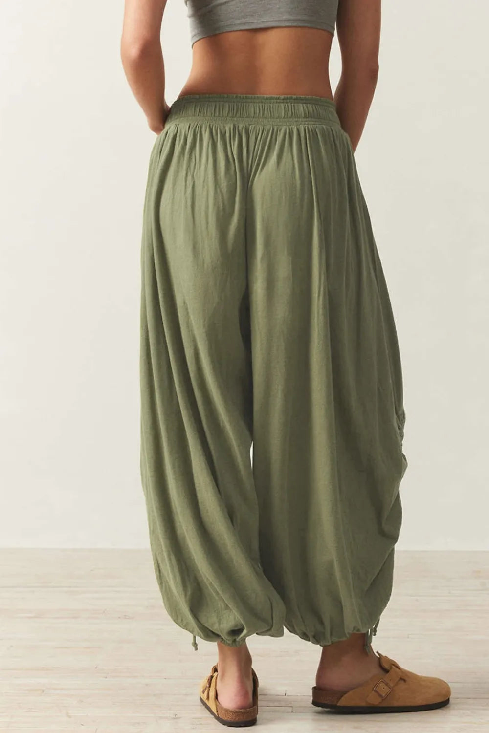Pants, opaque, ruched, drawstring, elastic waist, opaque, pleated, adjustable hem ties, no stretch, back view
