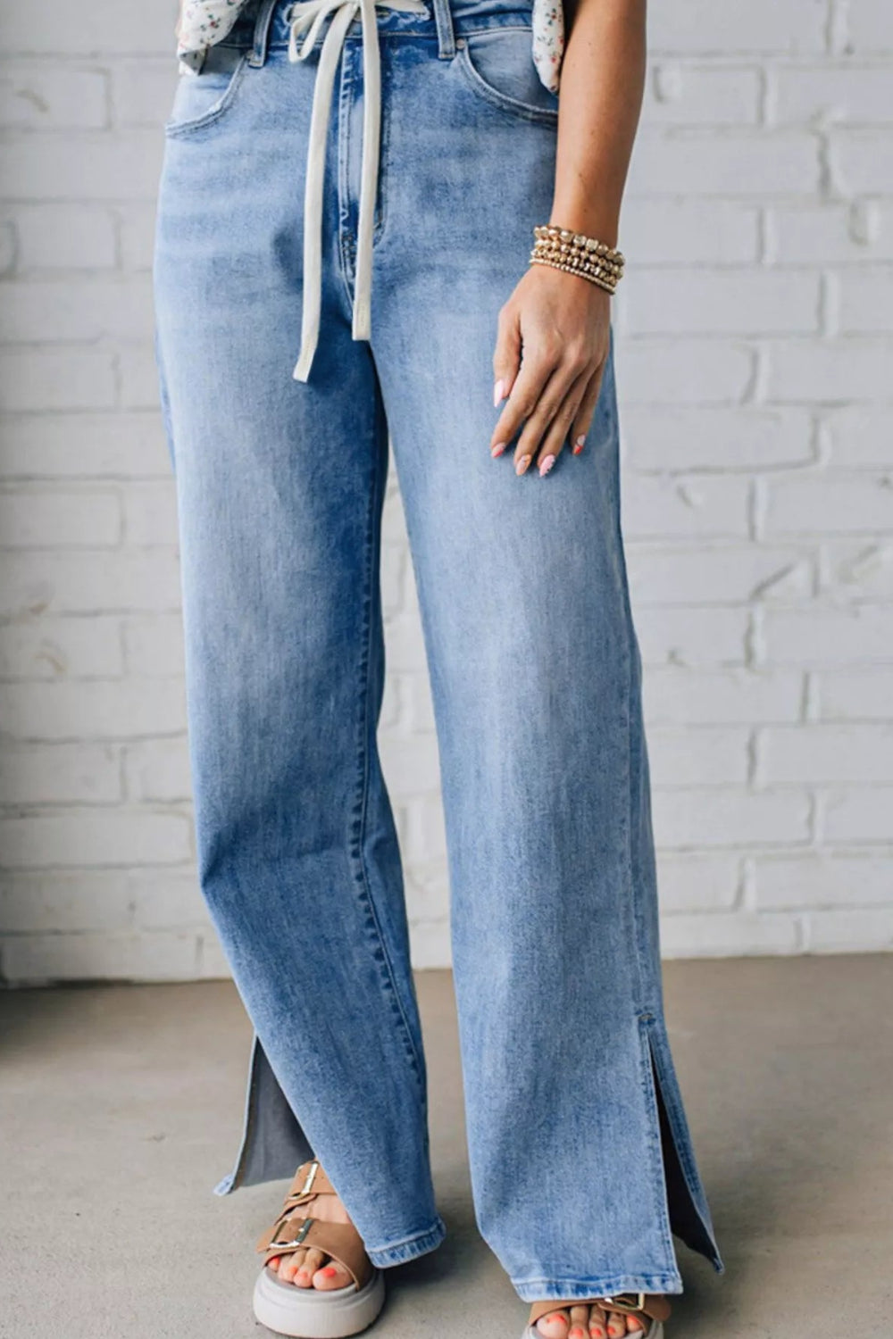 Jeans, slide slit, loose fit, wide leg, vintage wash, drawstring, button/zipper closure, pocketed, belt loops, some stretch, front view
