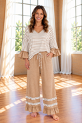 * Two-piece pant set
* Striped
* V-neck
* Long sleeve
* Drop shoulder
* Ruffled cuffs
* Side slit
* Elastic waist
* Drawstring
* Pocketed
* Ruffled
* Contrast trim
* Moderate stretch