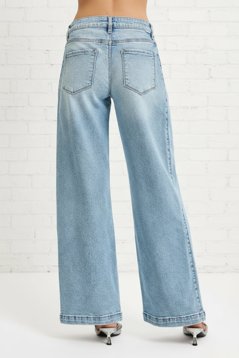 Risen Jeans, Mid-rise, wide barrel, transferable, leg snap, closed hem, medium washed, belt loops, button/zipper closure, pockets, slightly stretchy, back view
