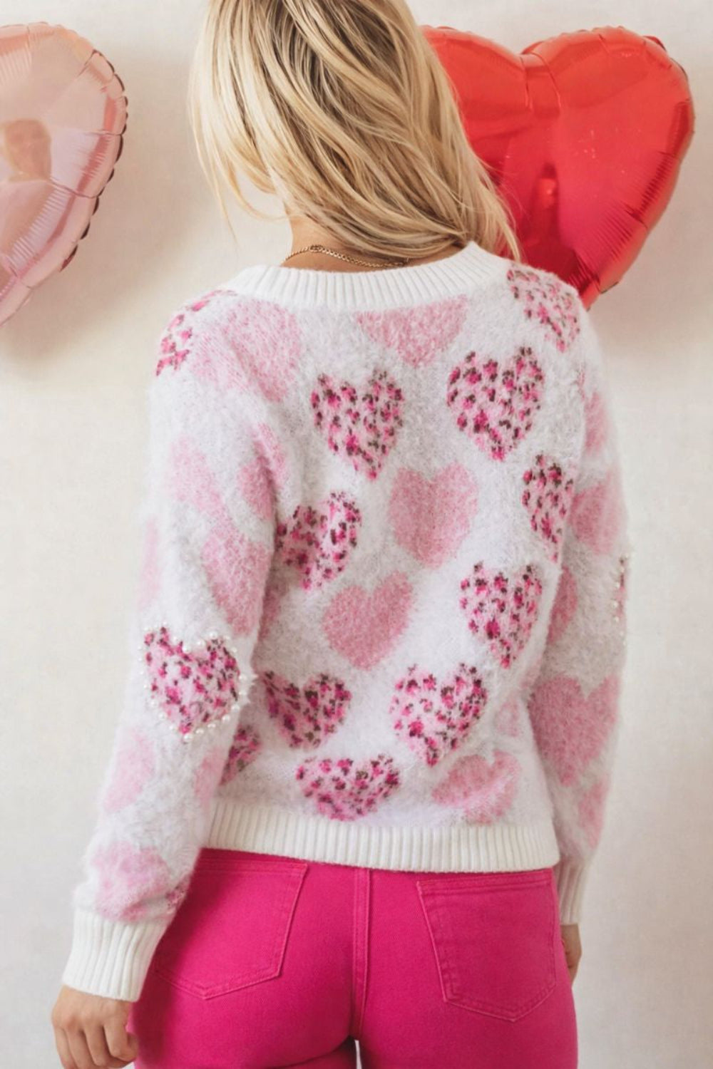 sweater, pullover, round neck, drop shoulder, ribbed neck, cuffs and hem, long sleeve, fuzzy texture, hearts with leopard print adorned with pearl trim, slightly stretchy, back view