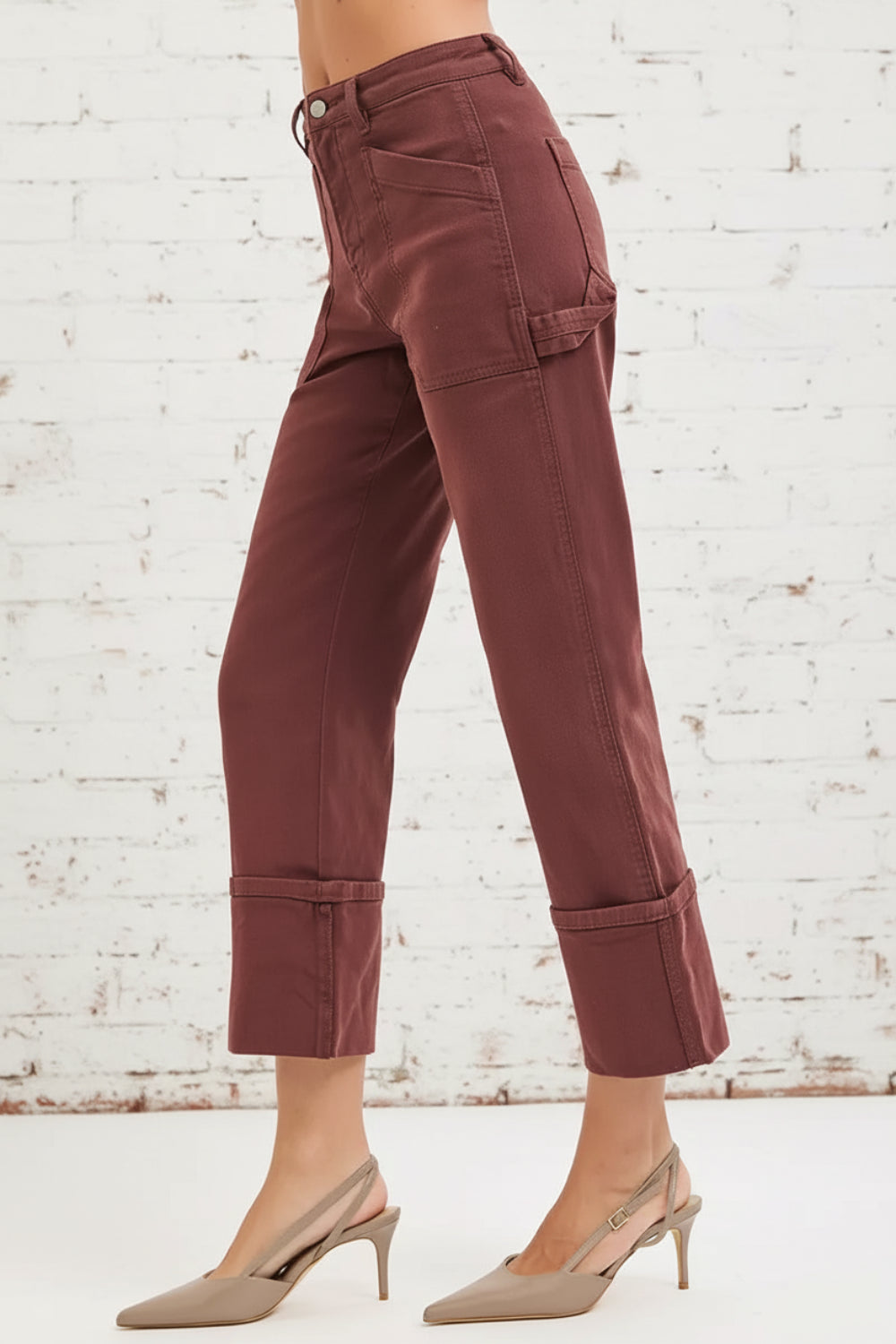 Risen jeans, full-size, high-rise, carpenter, wide leg, relaxed fit, pocketed, button/zipper closure, belt loops, cuffed hem, slightly stretchy, side view