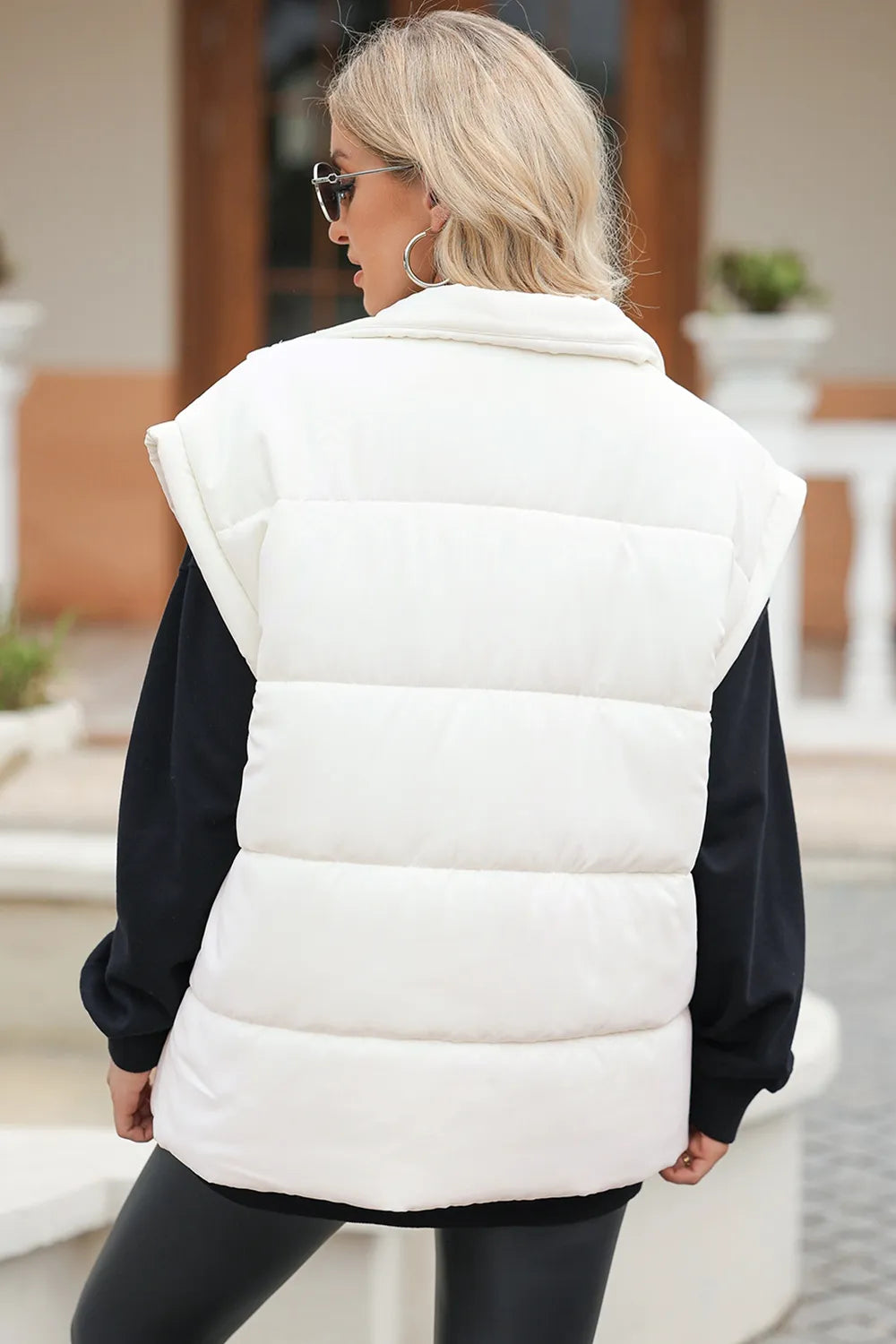 Puffer vest, insulated, lined, collar, zippered, pocketed, oversized, sleeveless, no stretch, back view