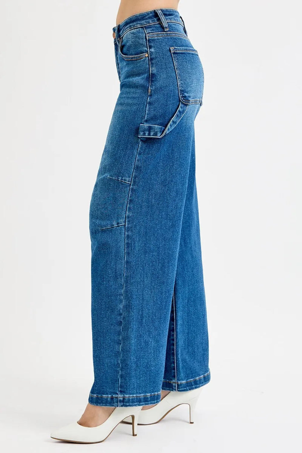 Risen Jeans, full-size, high-rise, darted, wide leg, one side hammer loop, pocketed, belt loops, button/zipper closure, washed, raw hem, slightly stretchy, side view

