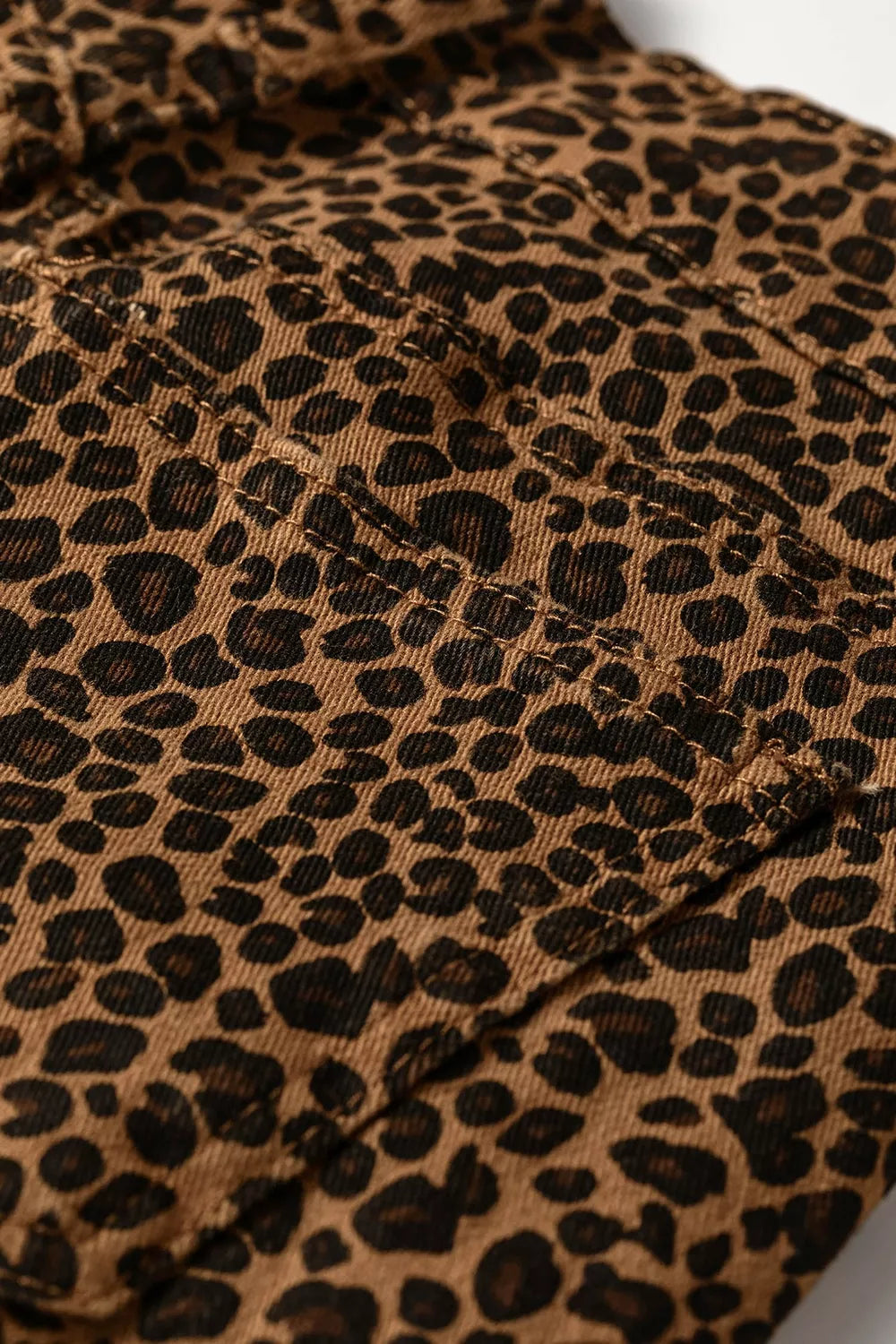 * Shift jean
* Leopard print
* High-waist
* Button/zipper closure
* Belt loops 
* Pocketed
* Ankle length
* Ruffled hem
* Slightly stretchy