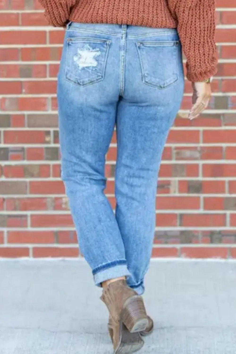 Jeans, mid-rise, skinny, distressed, raw hem, button/zipper closure, belt loops, pocketed, stretchy, back view