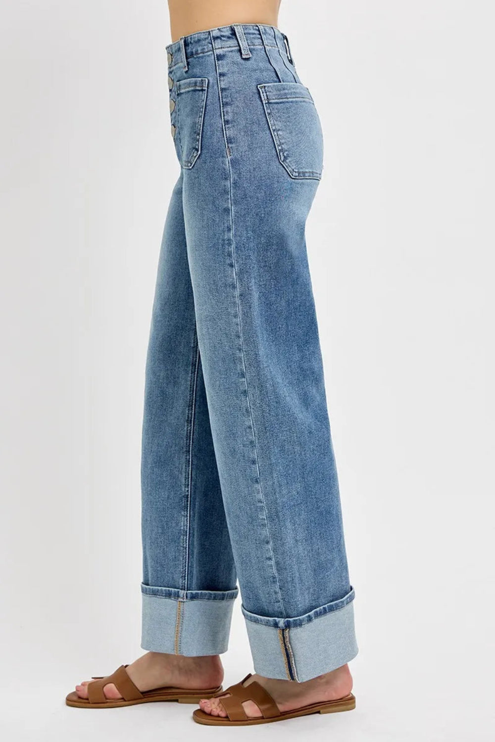 Risen Jeans, high-waisted, front patch pockets, button up, light wash, wide leg, cuffed, slightly stretchy side view

