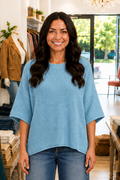 * Sweater
* Ribbed round neck
* Half sleeve
* Drop shoulder
* Exposed seams
* Knit fabric
* Rolled sleeve and hem
* Split sides
* Stretchy
